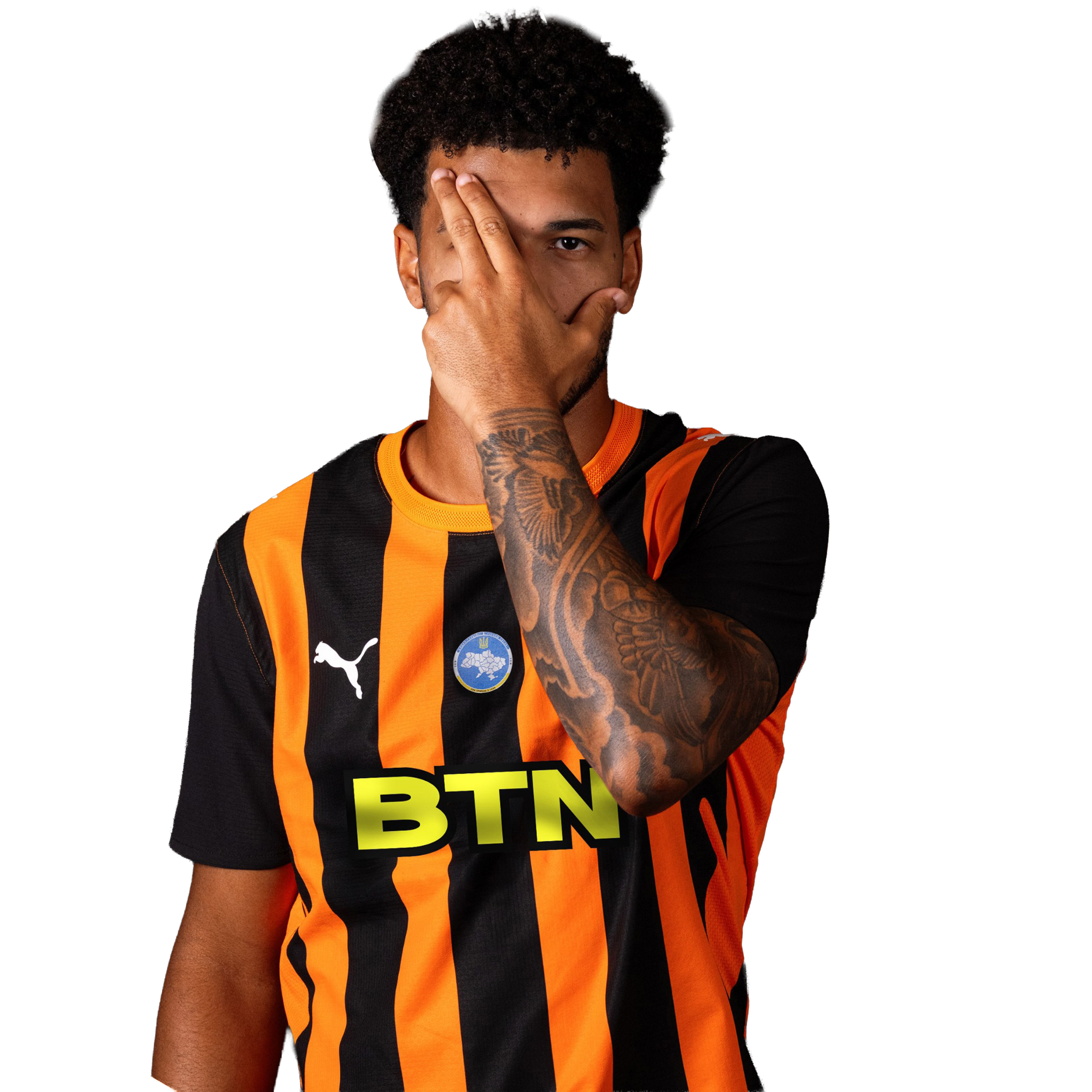 Footballer in orange and black kit